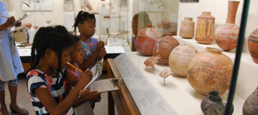 Image: Kids study ancient pottery from Nubia.