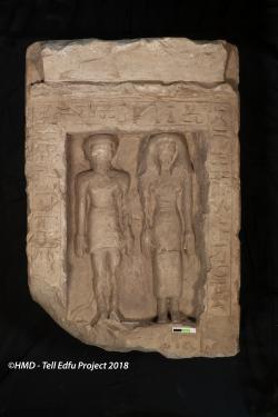 Limestone stela showing a man and women standing next to each other